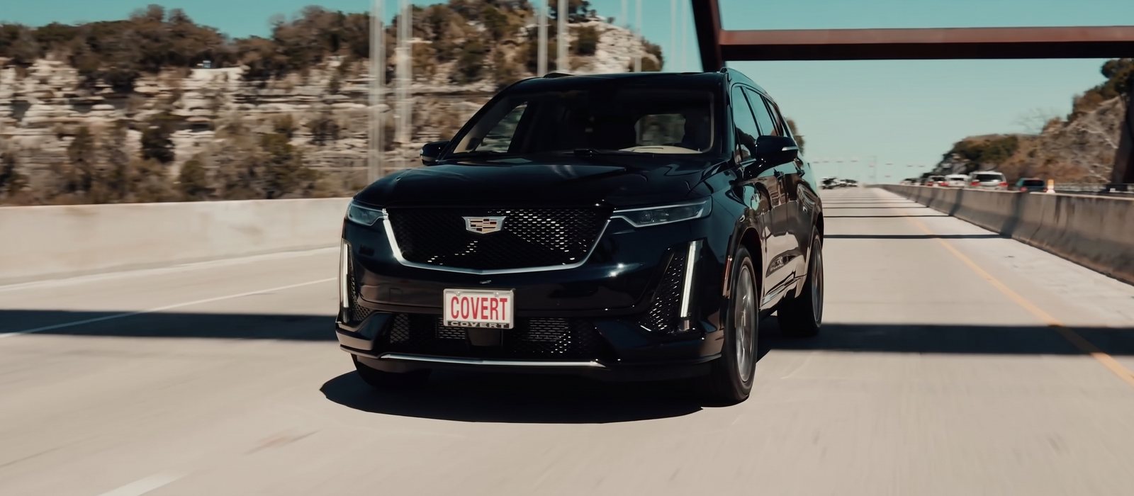 Covert Bee Cave film: a Covert Cadillac on the Loop 360 bridge, from the film of Covert vehicles on Hill Country roads